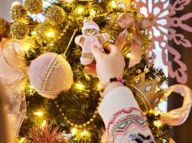 Children decorate the Christmas tree at the Master Mason Cottage at the Masonic Home for Children in Oxford, NC