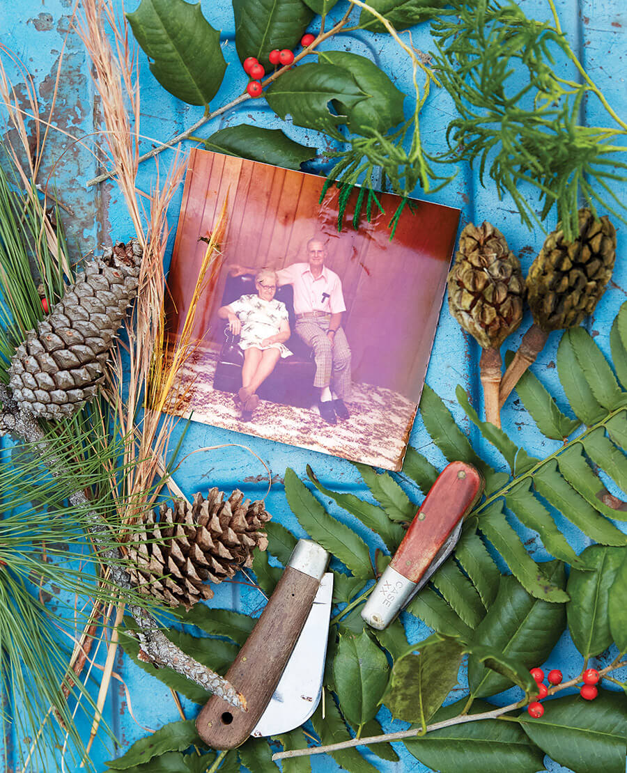 Photo of Rankin and Lannie Haywood with holly sprigs around it