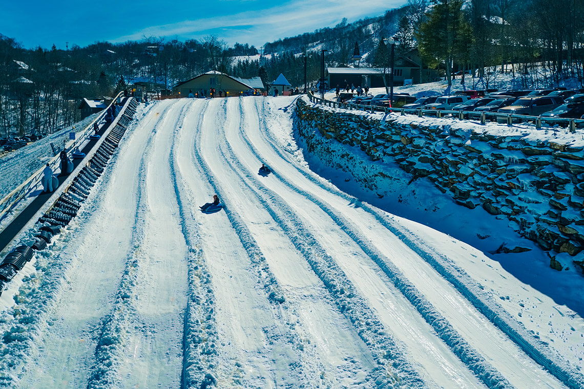 Tubing down snow chutes