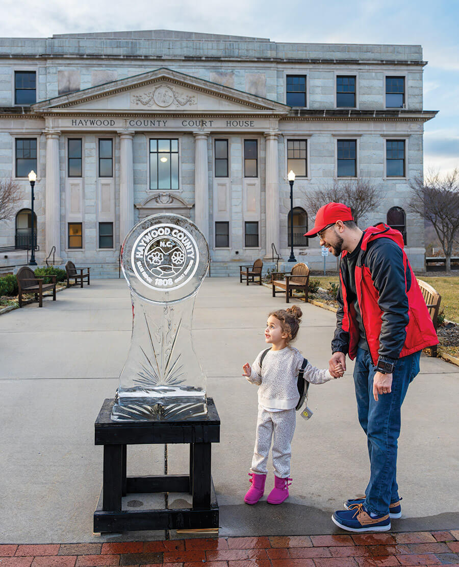 Little girl admires ice carving at the Haywood Ice Fest in Waynesville