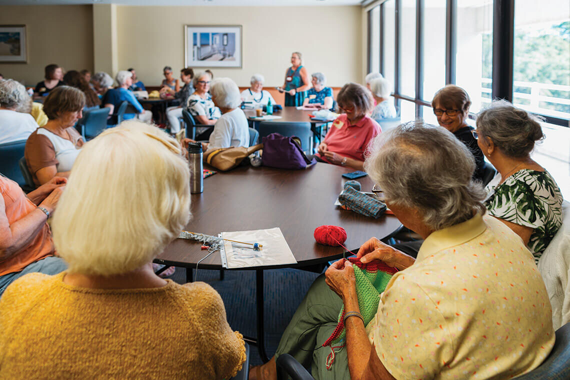 The members of the Cape Fear Knitters gather to work on their projects