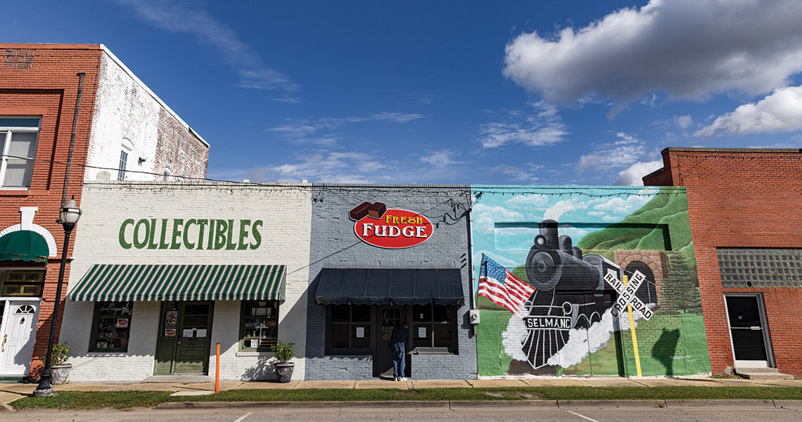 Mural of train on the storefronts in downtown Selma