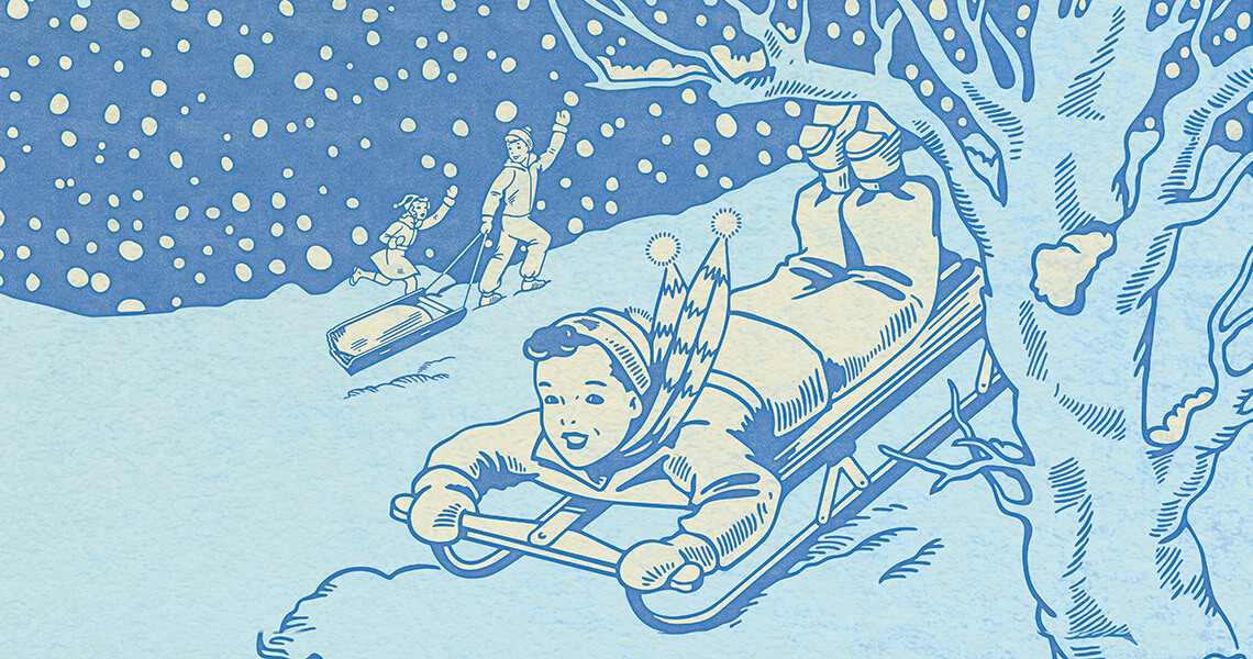 Children sledding down a hill