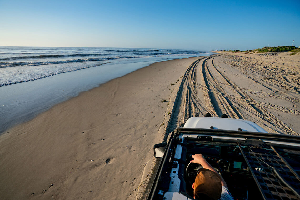Person driving on the beach in Corolla