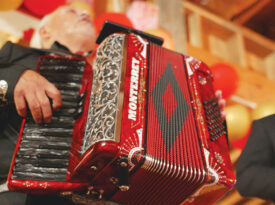 Father and son Cosme and Daniel Rangel perform at a quinceañero in Lincolnton