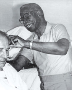 Wilson Potts at work in Potts Barber Shop