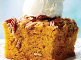 Slice of spice cake with ice cream on top