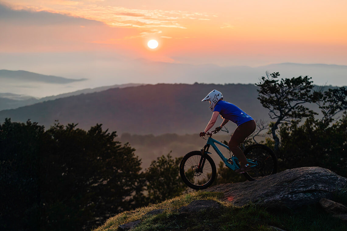 Person mountain biking