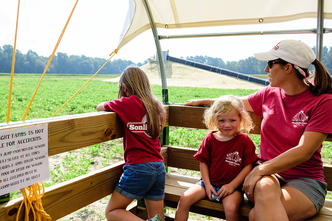 Children on a hayride at Sonlight Farms