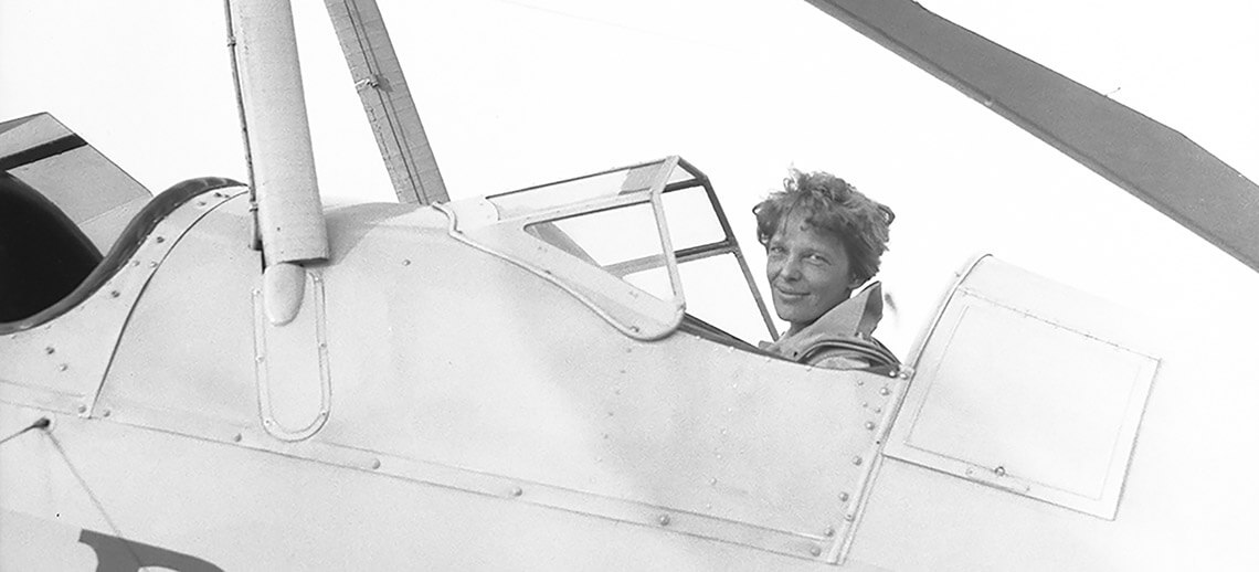 Amelia Earhart in her plane