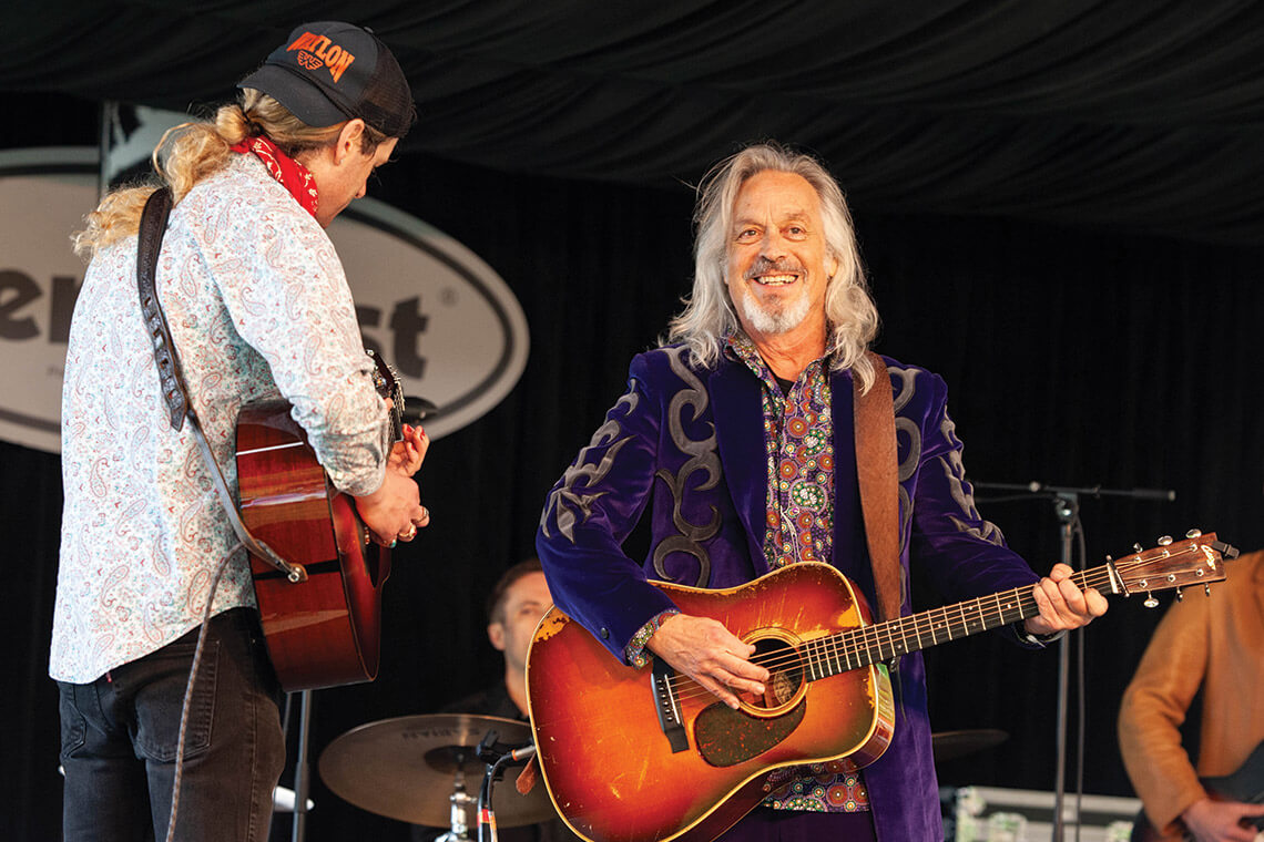 Jim Lauderdale on stage with a guitar at MerleFest