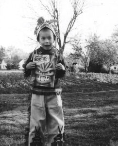 Jim Lauderdale, as a child, clutching a comic book