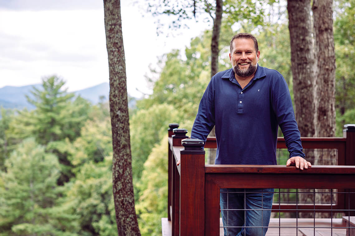 Trevor Whitson on a porch