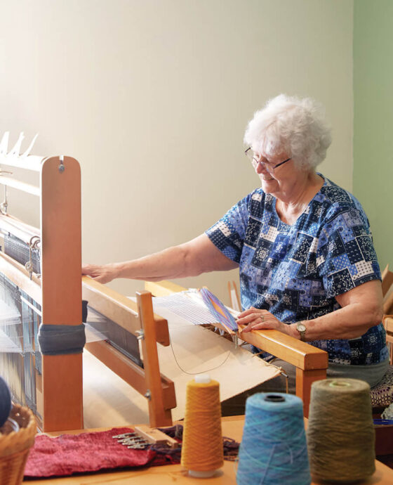 Mary Freas at the loom Lucy Morgan gave her.