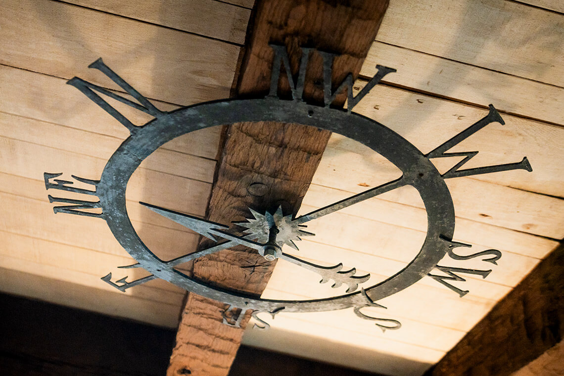 An iron compass on the ceiling of Flyaway Lodge