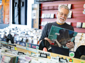 Mark Kemp shops the vinyl selection in a record store