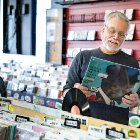 Mark Kemp shops the vinyl selection in a record store