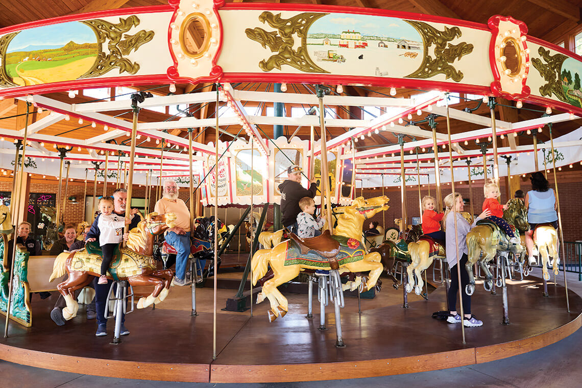 Children on the 1919 Herschell-Spillman Carousel