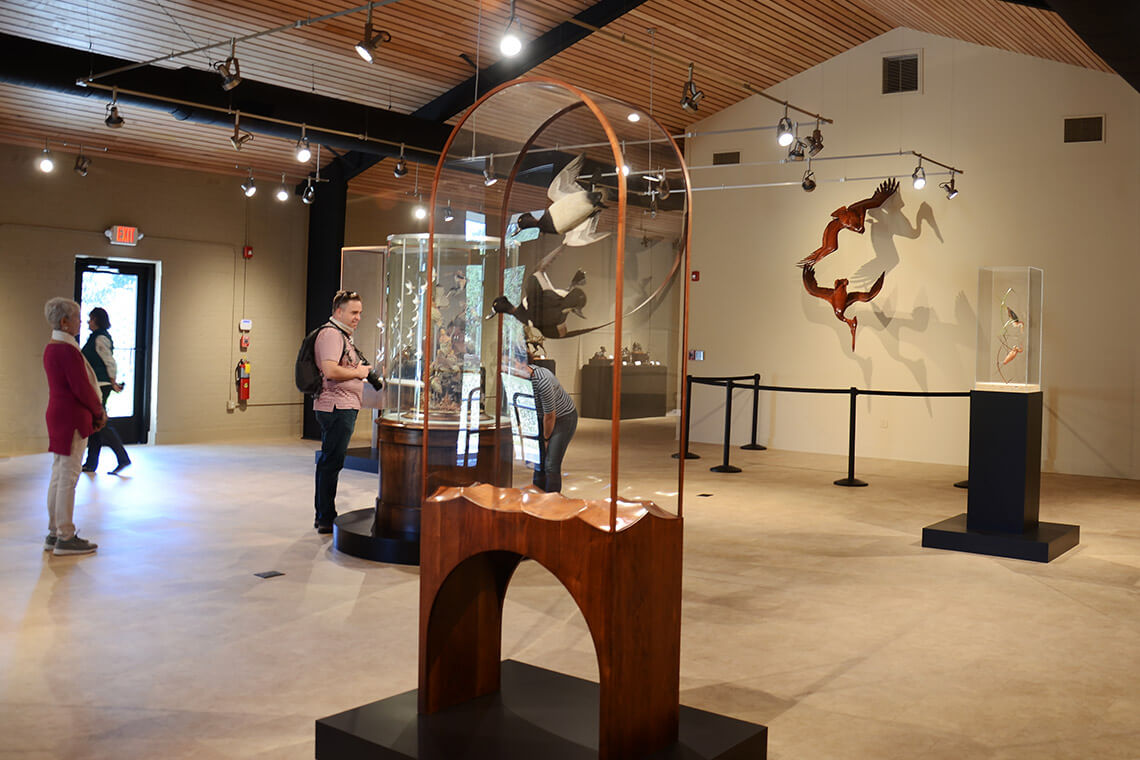 People view sculptures in Bleifeld Gallery