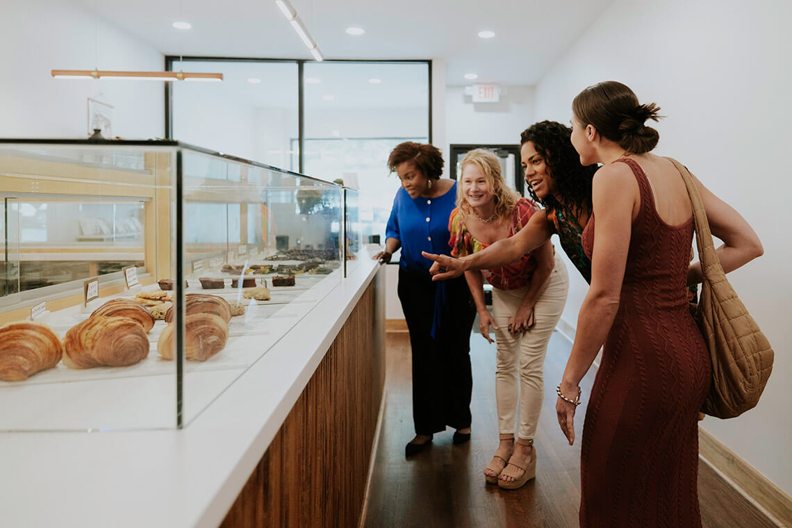 Women choosing desserts at Venture Chocolate + Wine Co.