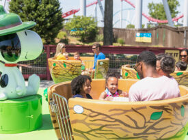 Family in the Woodstock Whirlybirds ride at Carowinds