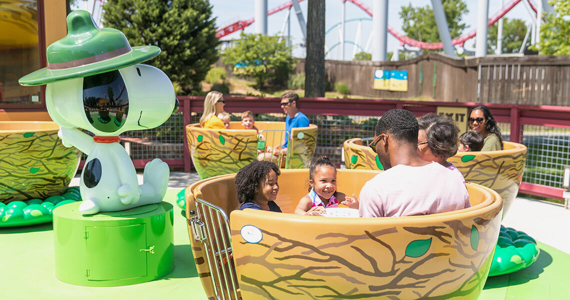 Family in the Woodstock Whirlybirds ride at Carowinds