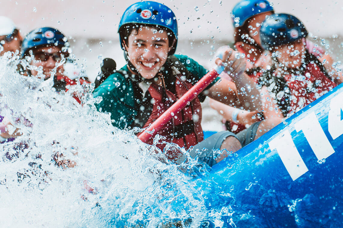 People in raft at the Whitewater Center