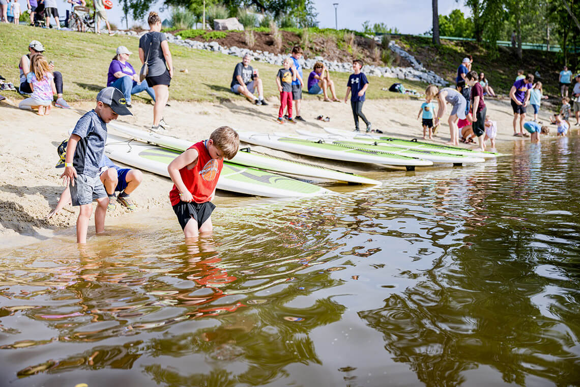 Children play on the beach at Wildwood Park
