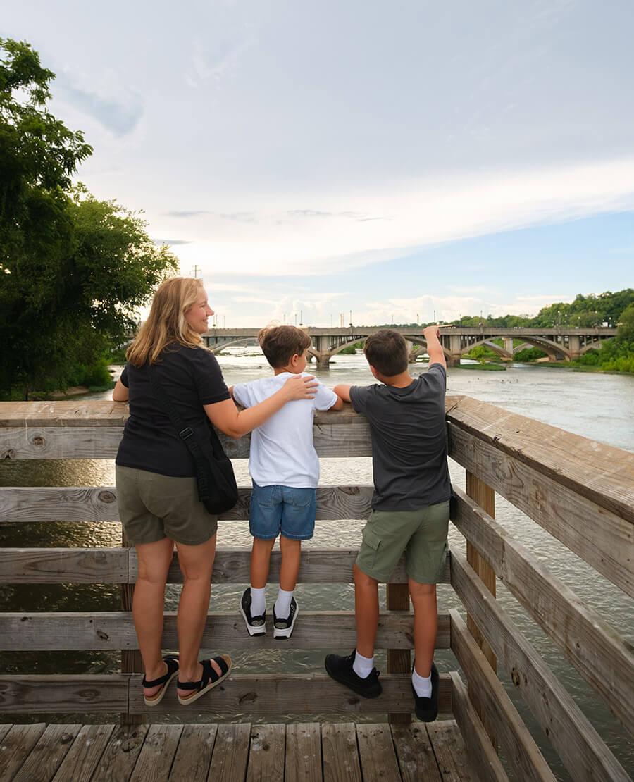 Mom and children look out over the Dan River