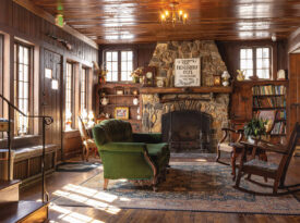 The NuWray's lobby with a fireplace and period furnishings