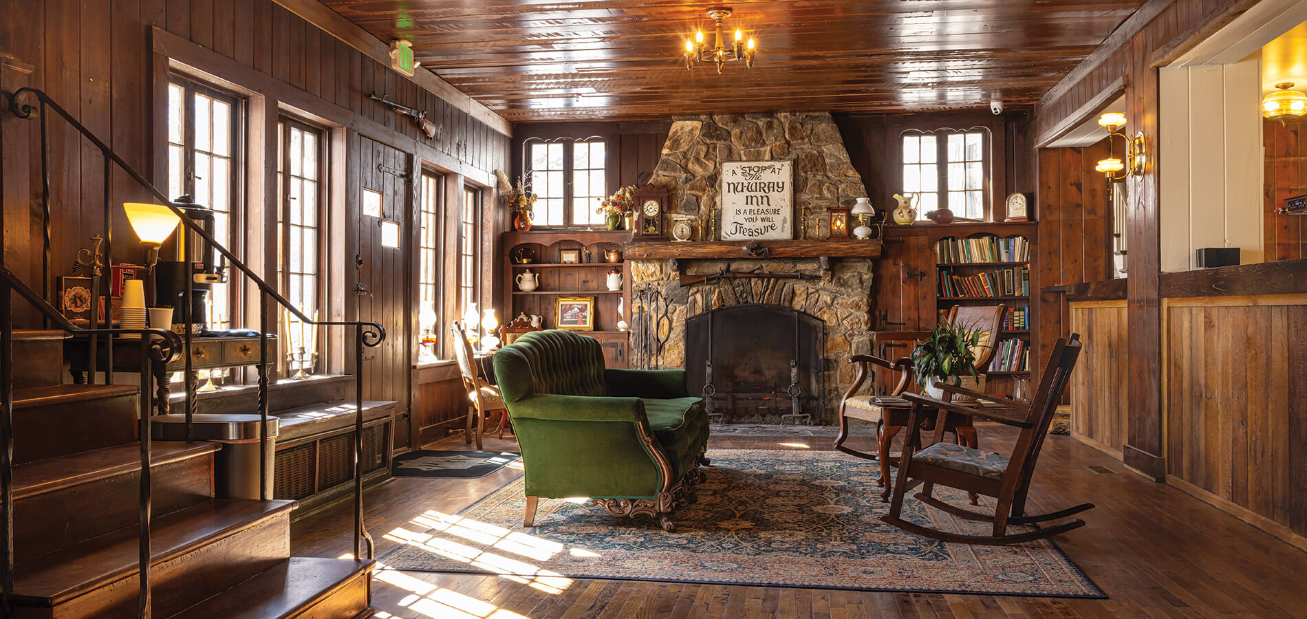 The NuWray's lobby with a fireplace and period furnishings