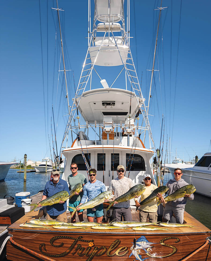 Military personnel aboard the Triple S on an Operation Resolute fishing trip