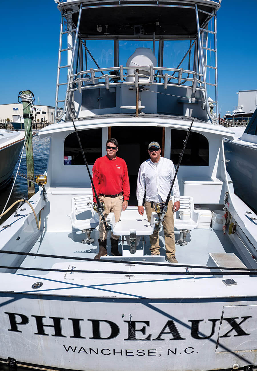 Capt. Jamie Reibel and Jeff on the deck of Phideaux