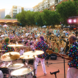 The Embers performing in front of a crowd in Raleigh