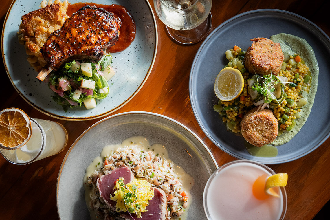Pork chop, crab cakes, and tuna at The Blue Point