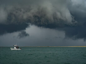 Boat on the ocean as a summer storm rolls in