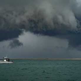 Boat on the ocean as a summer storm rolls in
