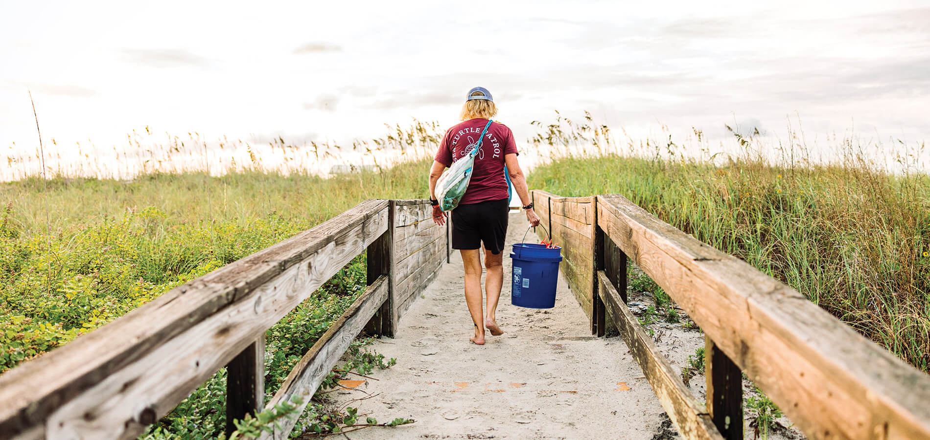 Busovne walks on to the beach for sea turtle patrol