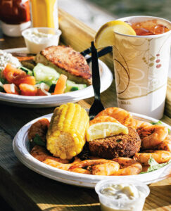 Thee Special with Provision Company with steamed shrimp, a crab cake, and corn