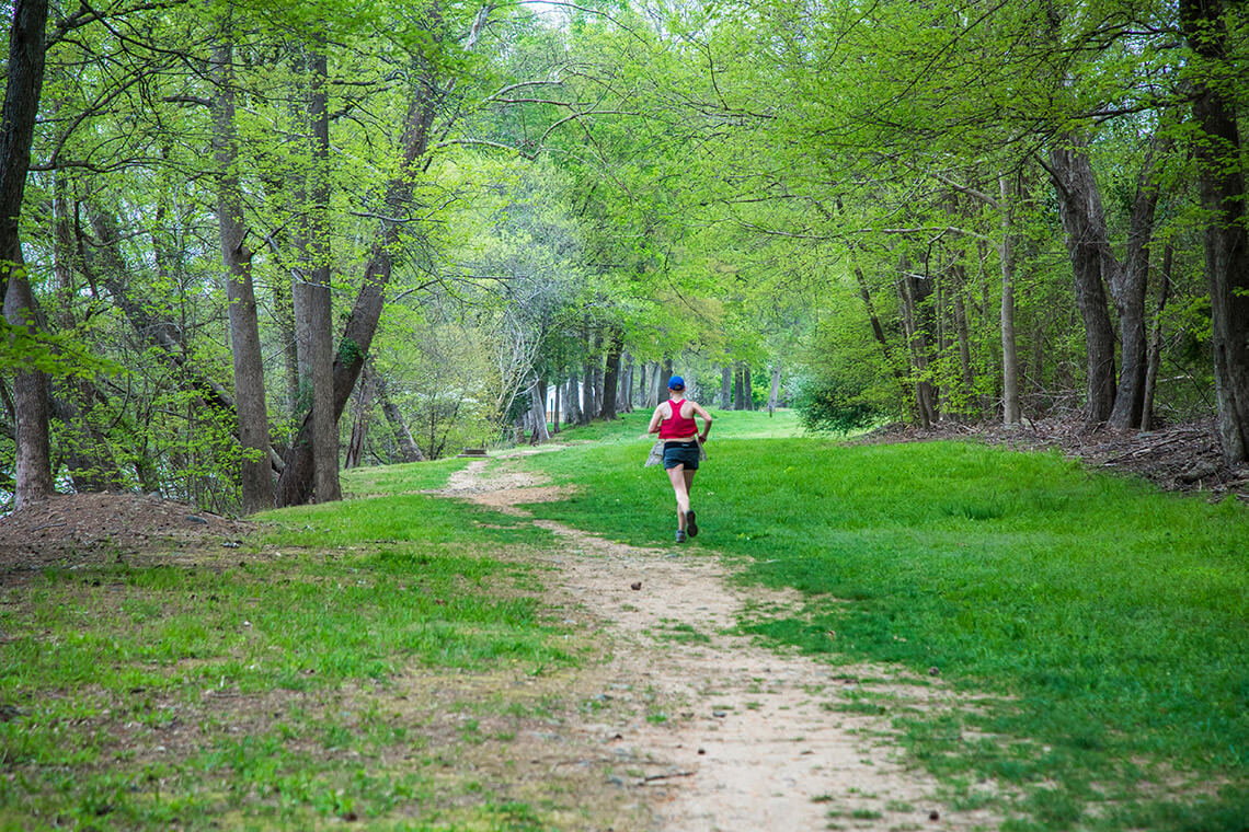 Woman running at River Falls Park