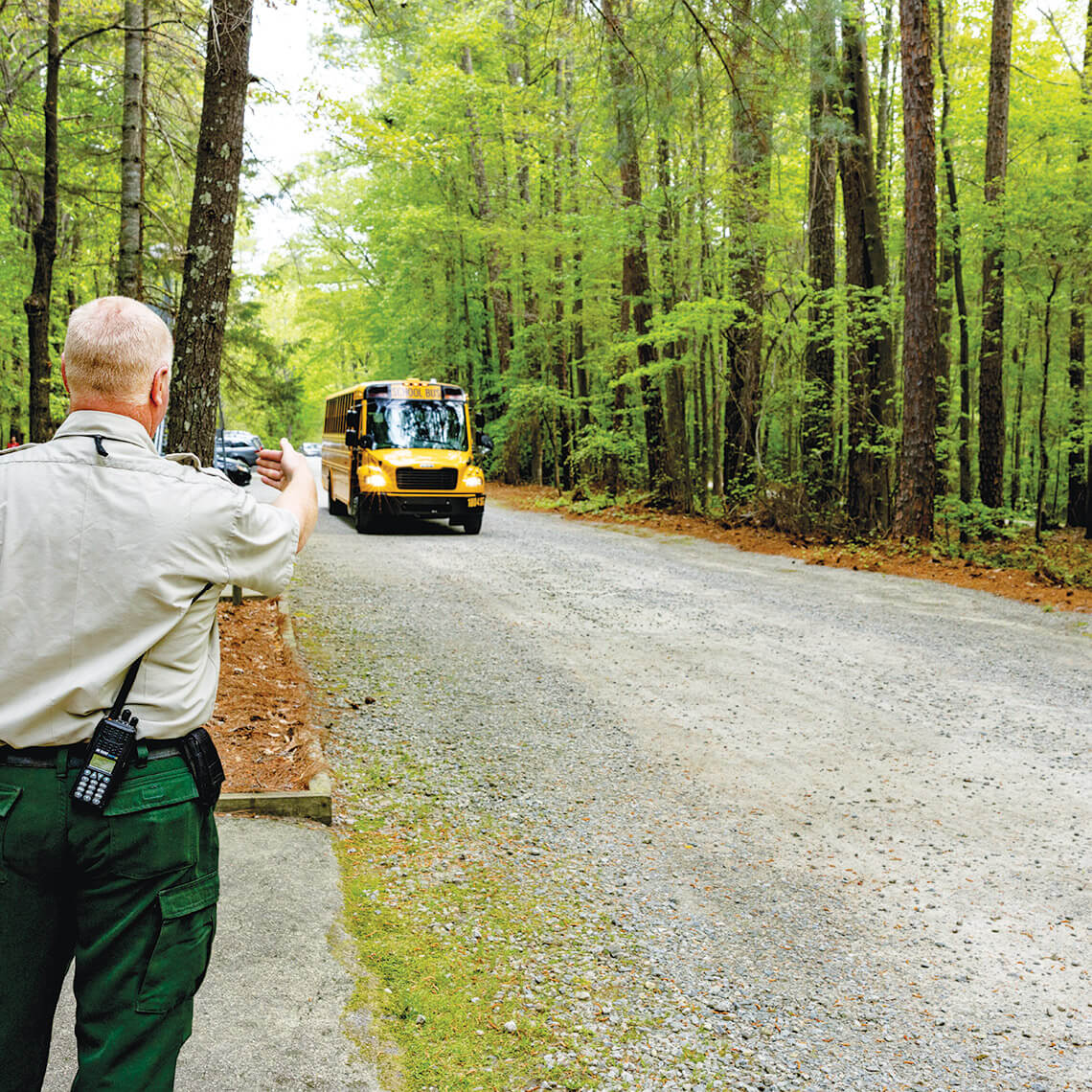 Kevin Pittman greets a school bus