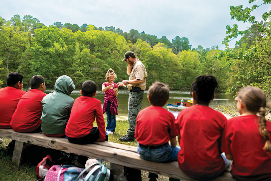 Ranger James Kimes instructs students at Clemmons Educational State Forest
