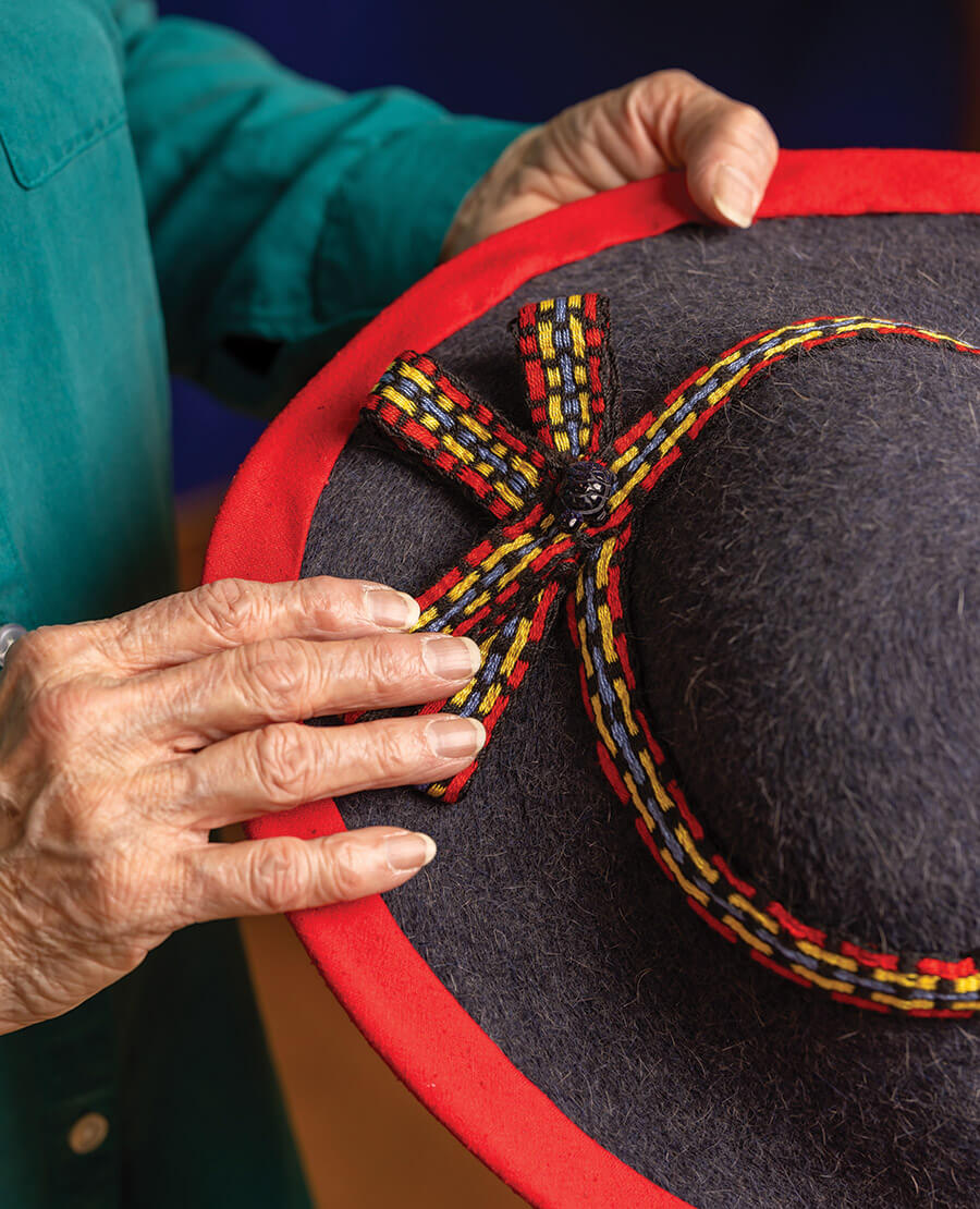 Bouchonnet holding a hat