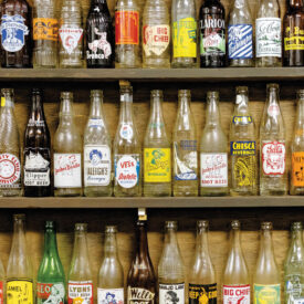 Shelves of vintage glass bottles