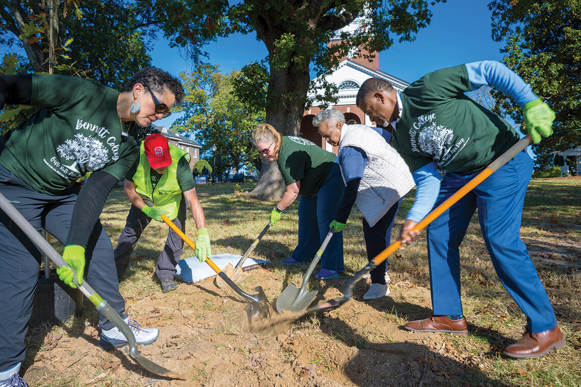 NeighborWoods volunteer planting trees at Bennett College's campus
