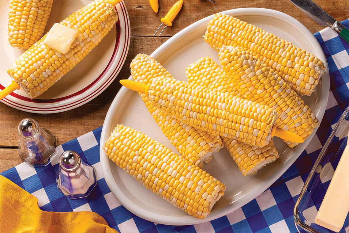 Plate piled with ears of sweet corn
