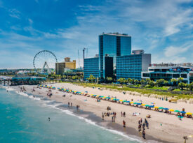 Overhead view of Myrtle Beach with towering hotels and observation wheel