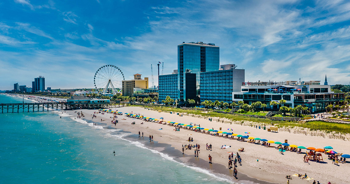 Overhead view of Myrtle Beach with towering hotels and observation wheel