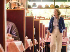 Denise Doyle strides between the booths at Barry's Cafe