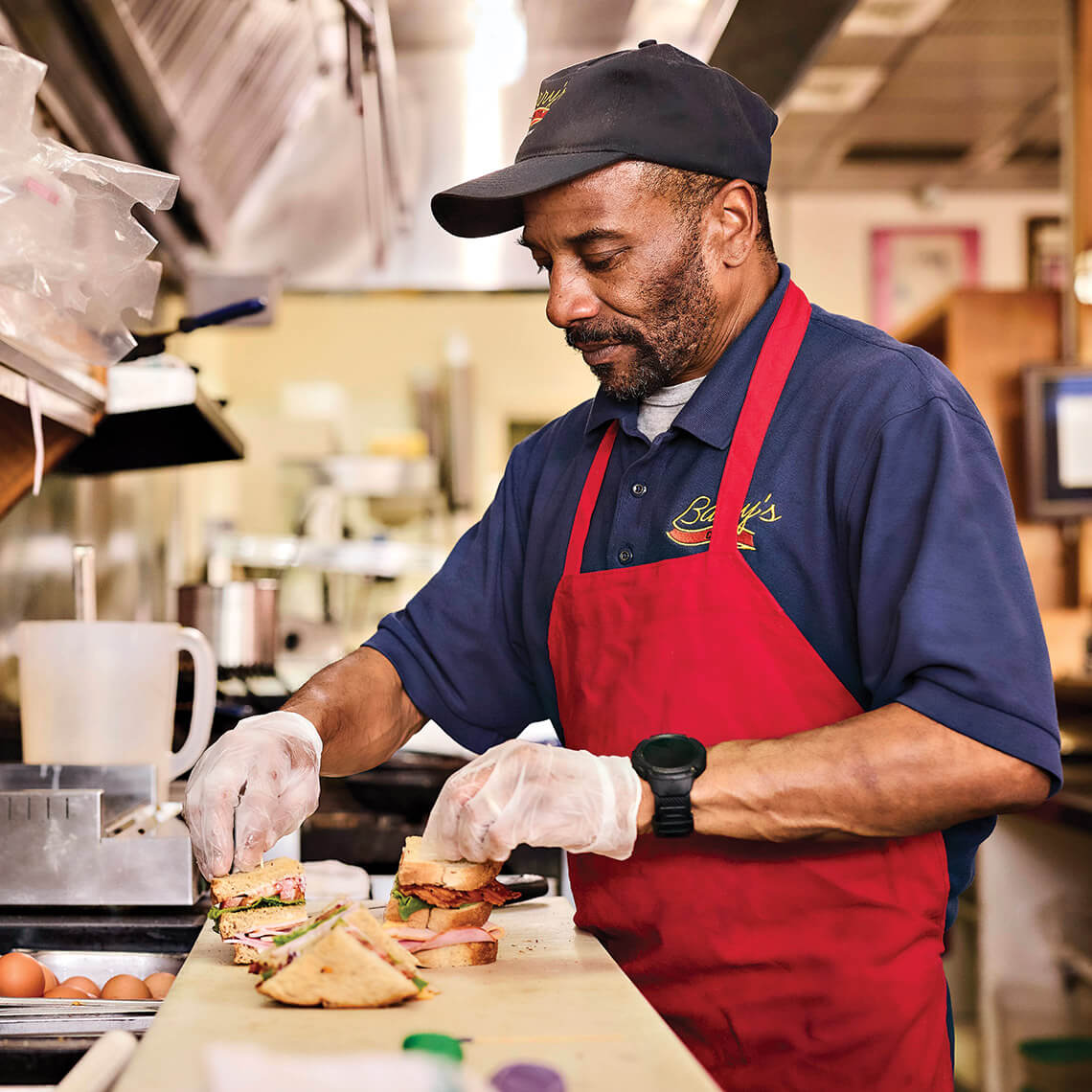 Michael Hudson preparing sandwiches at Barry's Cafe